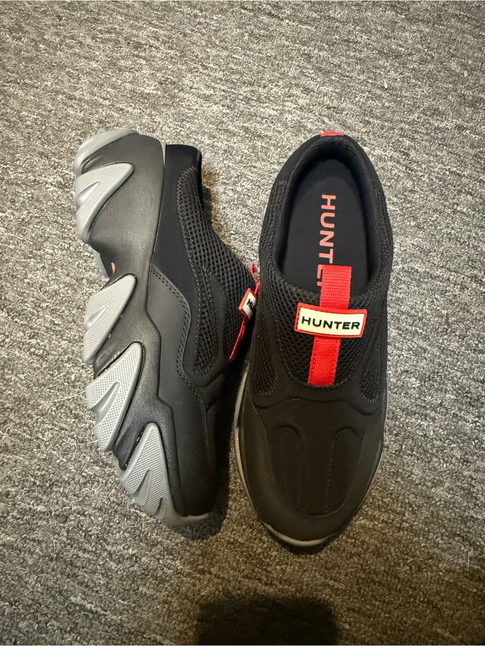 Hunter Men’s Black Slip-On Sneakers with Red Pull Tab and Gray Sole